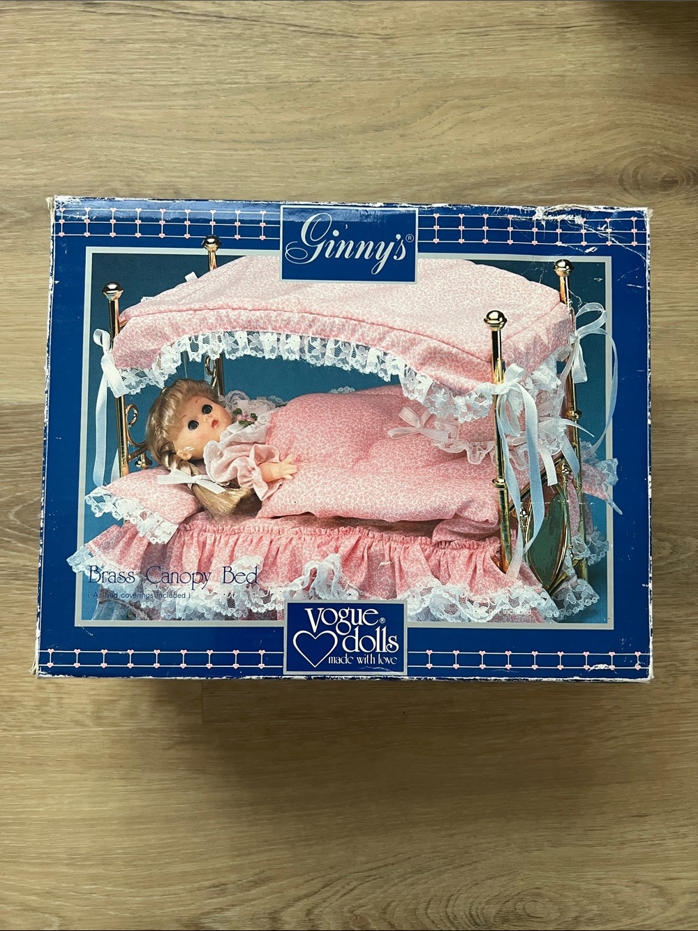 Ginny’s Brass Canopy Doll Bed by Vogue Dolls with Pink Bed Coverings